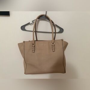 Kate spade shoulder purse. Used with a slight stain at bottom of bag.